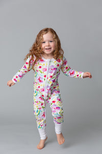 Young girl wearing a Little Zips onesie